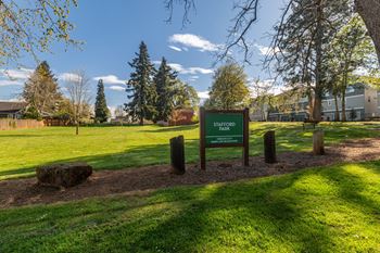 Entrance sign surrounded by green lawn